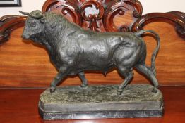 A most impressive bronze statue of a bull, on marble base, width 63cm.