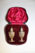 A cased pair of silver sifters by Walker and Hall , Sheffield.