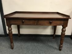 A Victorian mahogany writing desk fitted with two drawers, width 114 cm.