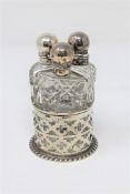 A silver three-part dressing table bottle set, Birmingham, John Grinsell & Sons.