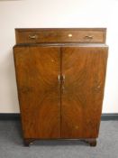 An early 20th century burr walnut double door cabinet, width 79cm.