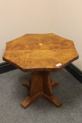 An Albert 'Eagleman' Jeffray oak octagonal coffee table, with carved eagle signature, width 52cm.