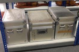 Three aluminium flight cases.