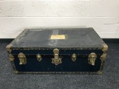 An early 20th century brass bound shipping trunk.