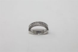 An 18ct white gold diamond half eternity ring,