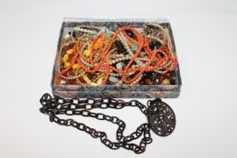 A nineteenth century tortoise shell necklace and pendant,