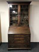 A George III oak bureau bookcase, width 100cm.