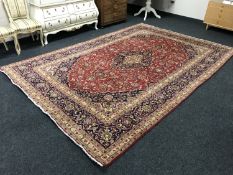 A Mahal carpet, the central indigo anchor medallion upon a strawberry foliate field,