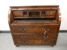 A 19th century mahogany cylinder bureau, with fitted interior, above three drawers, width 113cm.