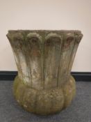 A concrete garden planter, height 56cm.