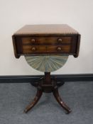 A Victorian mahogany dropleaf work table, on sabre legs raised on brass castors, width 44cm.