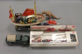 A Revell Ferrari F430 model kit, together with a tug boat, a commercial truck, farm vehicle.
