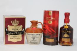 John Munro & Son - King of Kings, De luxe Scotch, in earthenware flagon, together with Berry Bros.