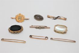 A collection of 9 Victorian and later brooches in yellow metal, some indistinctly stamped.