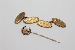 A pair of 9ct gold oval cufflinks, 3.5g, together with a Victorian stick pin.