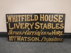 An early 19th century painted pine sign, 'Whitfield House Livery Stables,