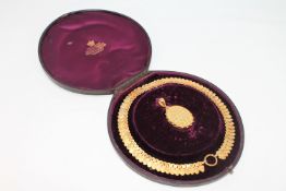 A fine quality Victorian yellow metal necklace and locket, in original box.