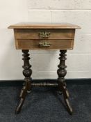 A 19th century mahogany work table on twin pedestal base, width 47cm.