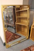 A contemporary gilt bevelled overmantel mirror, width 118cm.