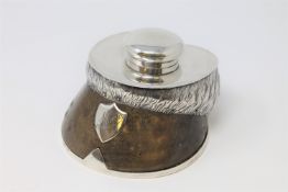 A silver mounted horseshoe inkwell,