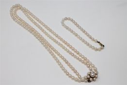 A double-strand cultured pearl necklace with 14ct gold clasp, length 41cm,