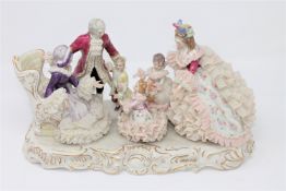 An Irish Dresden porcelain figure, Grandmother's Birthday, width 33cm.
