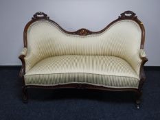 A continental mahogany shaped back settee, width 147cm.