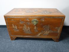 A mid 20th century carved Chinese camphor wood chest, width 104cm.