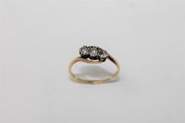 An early twentieth century diamond three stone ring, approximately 0.25ct, size O/P, 2.3g.