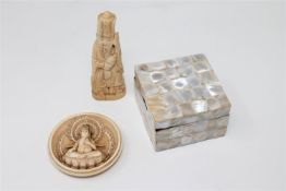 A late 19th century Indian carved ivory circular plaque depicting a deity (probably the lid of a