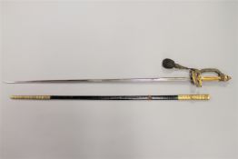 A George V court sword, with 81cm steel blade and brass mounted leather scabbard.