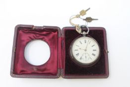 A silver open faced pocket watch, Chester 1881, with two keys and travel case.