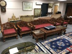 A good quality eight piece carved Eastern hardwood lounge suite, comprising of three seater settee,