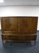 A mid 20th century walnut bowfront sideboard, width 171cm.