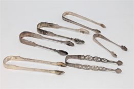 Six pairs of Georgian and later silver sugar tongs, various dates and makers, 225g gross.