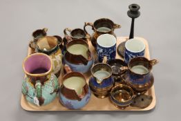 An English Majolica water jug, together with a small collection of Victorian copper lustre jugs,