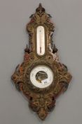 A Victorian holosteric barometer ornately mounted in embossed brass.