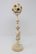 A late 19th/early 20th century Chinese carved ivory puzzle ball on stand, height 42cm.