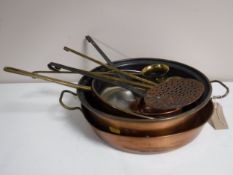 An antique brass and copper pan together with a copper sieve,