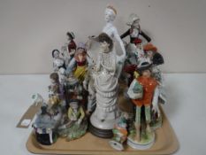 A collection of twenty continental figurines modelled as lady's and gentlemen etc