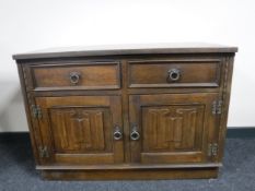 A Priory Oak double door cupboard