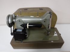 A mid 20th century Zephyr cased sewing machine