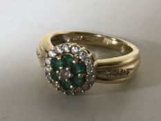 A 14ct gold emerald diamond ring, size M, 5.1g.