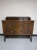 An early twentieth century sideboard on barley twist legs