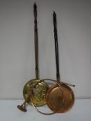 A copper and brass hunting horn and two bed warming pans.