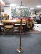 A Tiffany style standard lamp with shade