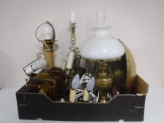 A box of continental brass table lights, wall lights, brass bowl and a brass oil lamp.