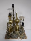 A tray of seven continental brass table lamps.