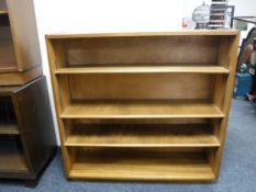 A set of walnut mid twentieth century bookshelves