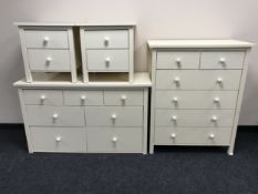 A contemporary four piece bedroom suite comprising of seven drawer chest,